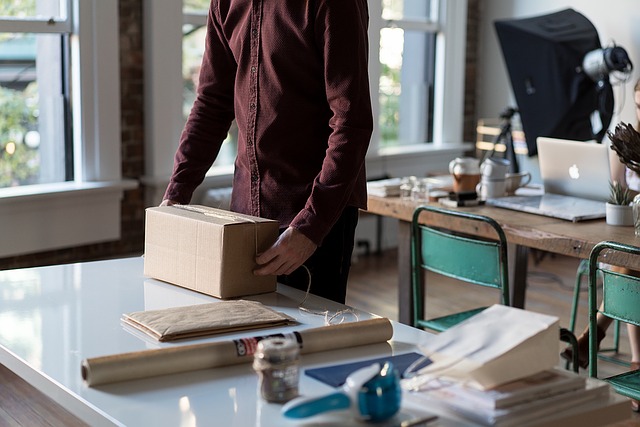 man preparing package shipment